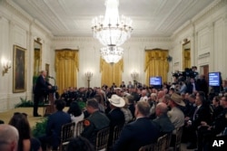 President Donald Trump speaks during an event to salute U.S. Immigration and Customs Enforcement (ICE) officers and U.S. Customs and Border Protection (CBP) agents in the East Room of the White House in Washington, Aug. 20, 2018.