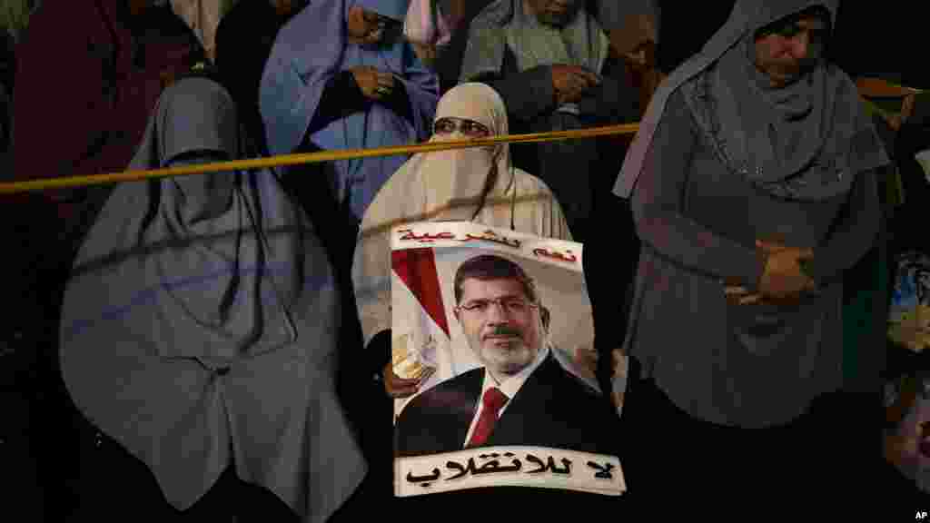 Supporters of Egypt's ousted President Mohamed Morsi chant slogans against Egyptian Defense Minister Gen. Abdel-Fattah el-Sissi in Nasr City, July 28, 2013.