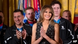 First lady Melania Trump smiles as she attends a Wounded Warrior Project Soldier Ride event in the East Room of the White House, April 6, 2017, in Washington. 