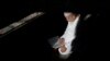 FILE - Abdul Barek Hajji, 70, a Bengali Muslim, reads the Koran while waiting for the Maghrib sunset prayer during Ramadan at the Abu Bakr Mosque, in Flushing, New York, May 31, 2017.