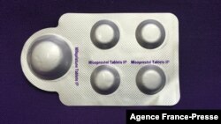 FILE - This image, courtesy of Plan C, shows a combination pack of mifepristone, left, and misoprostol tablets, two medicines used together to induce abortion, May 8, 2020.