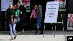 Signs advertising free measles vaccines and information about measles are displayed at the Rockland County Health Department in Pomona, N.Y., March 27, 2019. The county declared a local state of emergency over a measles outbreak that has infected 150 people since last fall.