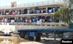 FILE - Laborers' accommodation is pictured in Sanaya Industrial Area in Doha, March 28, 2014.