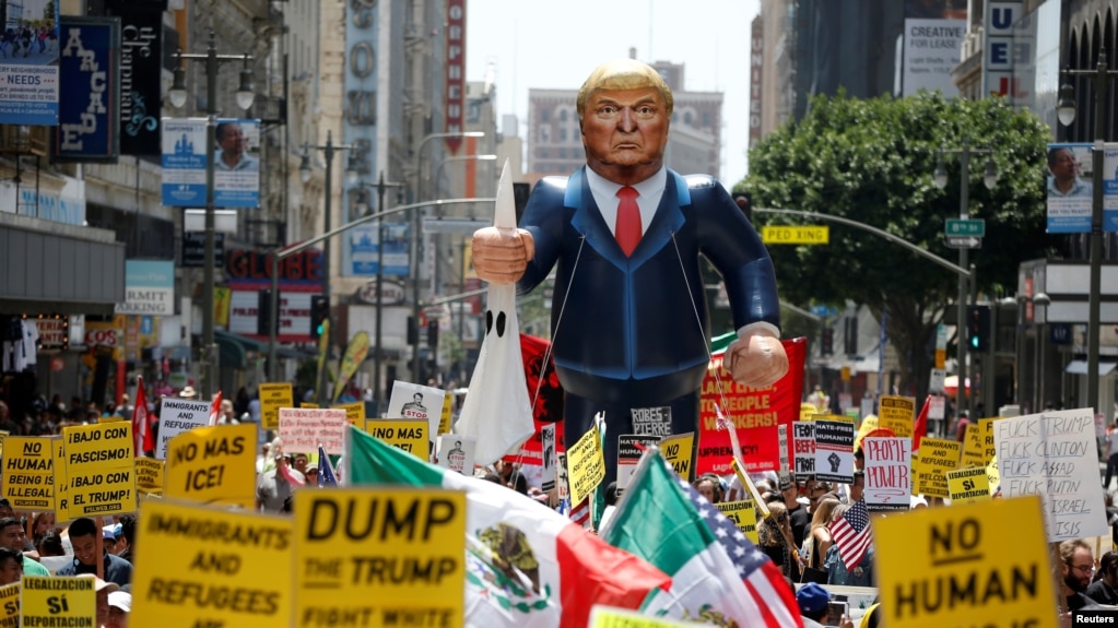 file people march with an inflatable effigy of republican presidential candidate donald trump during an file people march with an inflatable effigy of republican presidential candidate donald trump during an
