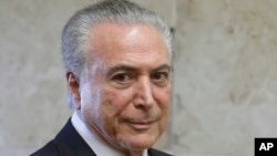 Brazil's President Michel Temer arrives to attend a swearing-in ceremony of the newly-confirmed Justice Minister Alexandre de Moraes, in Brasilia, Brazil, March 22, 2017. 