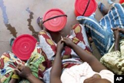 Fistula patients wait outside the operating room for a consultation.