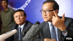 Opposition leader Sam Rainsy, right, said Tuesday that political negotiations with the ruling party have hit an impasse.