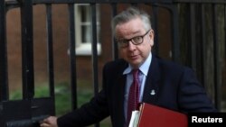 FILE - Britain's Secretary of State for Environment, Food and Rural Affairs Michael Gove leaves 10 Downing Street in London, May 22, 2018.