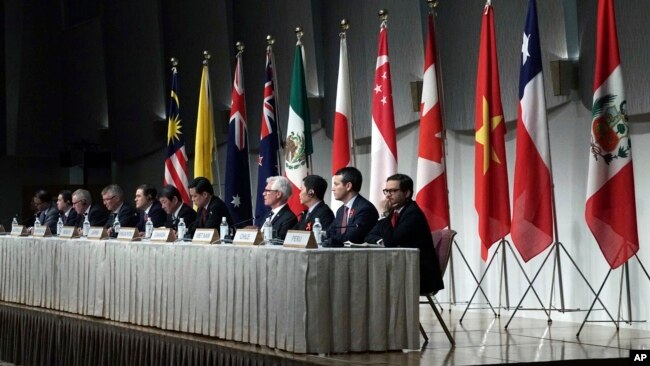 FILE - Officials representing countries of the Pacific Rim trade bloc attend a joint press conference after a session of the Comprehensive and Progressive Agreement for Trans-Pacific Partnership (CPTPP) in Tokyo, Japan, Jan. 19, 2019.