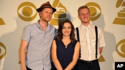 The Lumineers, (L-R) Wesley Schultz, Neyla Pekarek and Jeremiah Fraites pose for a photo backstage at the Grammy Nominations Concert Live! at Bridgestone Arena, Dec. 5, 2012, in Nashville, Tennessee.