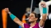 FILE - Rafael Nadal of Spain celebrates after defeating Matteo Berrettini of Italy in their semifinal match at the Australian Open tennis championships in Melbourne, Australia, Jan. 28, 2022.