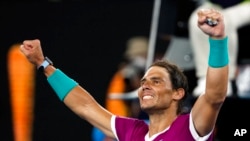 FILE - Rafael Nadal of Spain celebrates after defeating Matteo Berrettini of Italy in their semifinal match at the Australian Open tennis championships in Melbourne, Australia, Jan. 28, 2022.