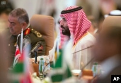 FILE - In this photo released by the state-run Saudi Press Agency, Saudi Crown Prince Mohammed bin Salman speaks at a meeting of the Islamic Military Counter Terrorism Coalition in Riyadh, Saudi Arabia, Nov. 26, 2017.