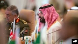FILE - In this photo released by the state-run Saudi Press Agency, Saudi Crown Prince Mohammed bin Salman speaks at a meeting of the Islamic Military Counter Terrorism Coalition in Riyadh, Saudi Arabia, Nov. 26, 2017. 