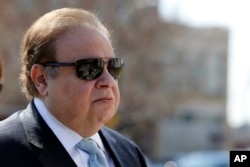 FILE - Dr. Salomon Melgen arrives at the Martin Luther King Jr. Federal Courthouse for his arraignment, in Newark, N.J., April 2, 2015.