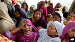 FILE - Pakistani Christian women mourn the death of a man killed in a bombing attack, in Lahore, March 28, 2016. A suicide bombing had targeted Christians gathered on Easter, the day before, in Lahore. Christians frequently complain of being harassed by radicals in Pakistan.