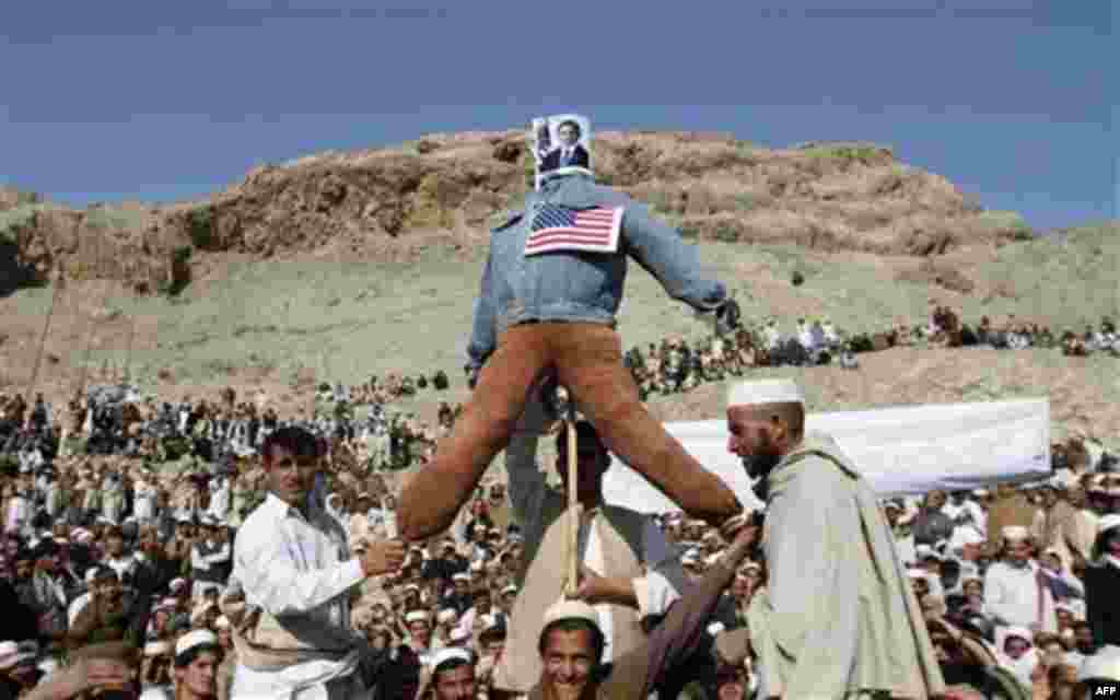 Afghans display an effigy of the US President Barack Obama during anti-US protest over burning of Qurans at a military bass in Afghanistan, in Ghani Khail, east of Kabul Friday, Feb. 24,2012. (AP Photo/Rahmat Gul)
