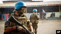 FILE - United Nations peacekeepers from Uruguay patrol a street in Goma, eastern Congo, July 13, 2012. 