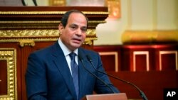 FILE- Egyptian President Abdel-Fattah el-Sissi addresses Parliament after being sworn in for a second four-year term, in Cairo, Egypt, in this June 2, 2018, photo provided by the media office of Egypt's presidency.