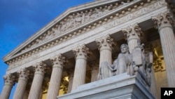 FILE - In this Feb. 13, 2016 file photo, the Supreme Court building at seen sunset in Washington.