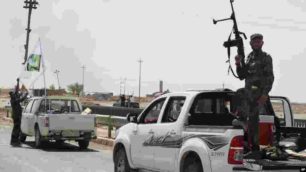 Shiite militiamen patrol in Amirli, 170 kilometers (105 miles) north of Baghdad, Iraq, Aug. 31, 2014. 