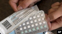 FILE - A one-month dosage of hormonal birth control pills is displayed in Sacramento, Calif., Aug. 26, 2016.