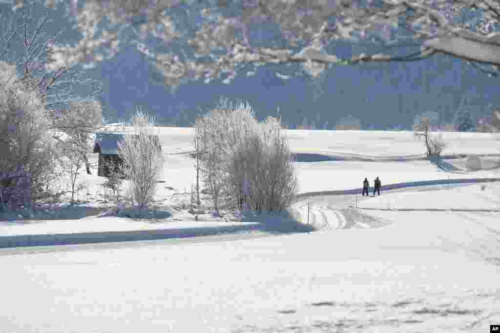Two cross-country skiers in Lofer, Austrian province of Salzburg