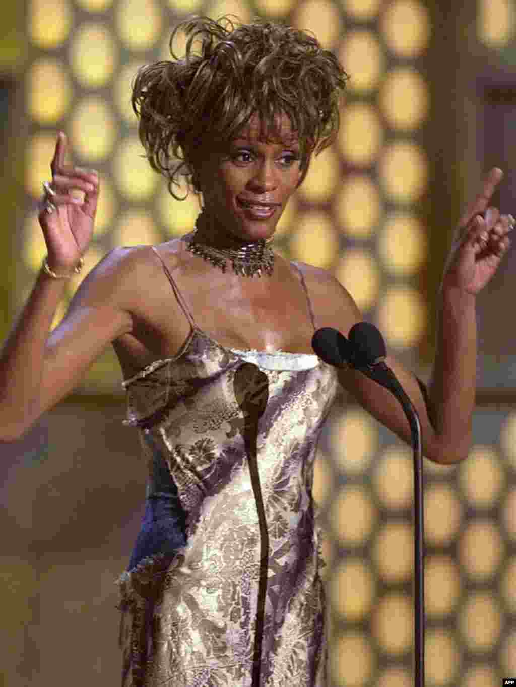 Whitney Houston accepting the first Lifetime Achievement Award at the first Black Entertainment Television awards, June 19, 2001, in Las Vegas. (AP)