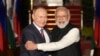 FILE - Russian President Vladimir Putin, left and Indian Prime Minister Narendra Modi greet each other before their meeting in New Delhi, India, Dec.6, 2021. 