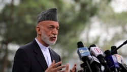 Afghanistan's former President Hamid Karzai speaks during a news conference in Kabul, Afghanistan, Tuesday, July 13, 2021. Former President Karzai calls on both the Afghan government and the Taliban to recontinue negotiations and end fighting in the country. (AP Photo/Rahmat Gul)