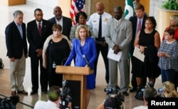 Charlotte Mayor Jennifer Roberts speaks to reporters the morning after protests against the police shooting of Keith Lamont Scott, in Charlotte, N.C., Sept. 21, 2016.