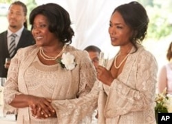 Loretta Devine, left, and Angela Bassett in a scene from "Jumping The Broom"