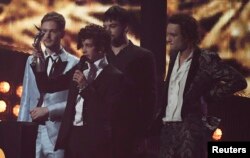 The 1975 accept the award for Best British group at the Brit Awards at the O2 Arena in London, Feb. 22, 2017.