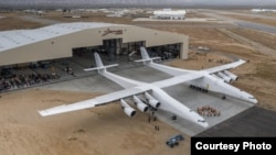 The world's largest plane, called Stratolaunch, is wheeled out of its hangar for the first time on May 31, 2017 at the Mojave Air & Space Port in California. (Stratolaunch Systems)