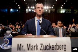 Facebook CEO Mark Zuckerberg arrives to testify before a joint hearing of the Commerce and Judiciary Committees on Capitol Hill in Washington, Tuesday, April 10, 2018, about the use of Facebook data to target American voters in the 2016 election.