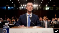 Facebook CEO Mark Zuckerberg arrives to testify before a joint hearing of the Commerce and Judiciary Committees on Capitol Hill in Washington, April 10, 2018.