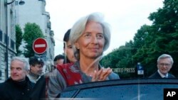 Head of the International Monetary Fund, Christine Lagarde, leaves a special court house Paris, Friday, May 24, 2013. IMF chief Christine Lagarde says a Paris court has named her as a key witness in an investigation into a controversial payoff to an outsp