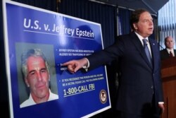 FILE: U.S. Attorney Geoffrey Berman, points to a photograph of Jeffrey Epstein as he announces the financier's charges of sex trafficking of minors and conspiracy to commit sex trafficking of minors, in New York, U.S., July 8, 2019.