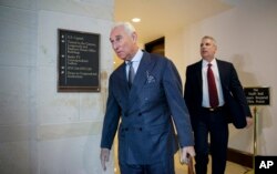 FILE - In this Sept. 26, 2017, file photo, longtime Donald Trump associate Roger Stone arrives to testify before the House Intelligence Committee.