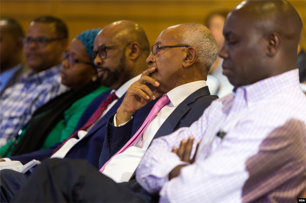 Audience members reflect in deep thought, including Africa Division Director Negussie Mengesha (second from the right).