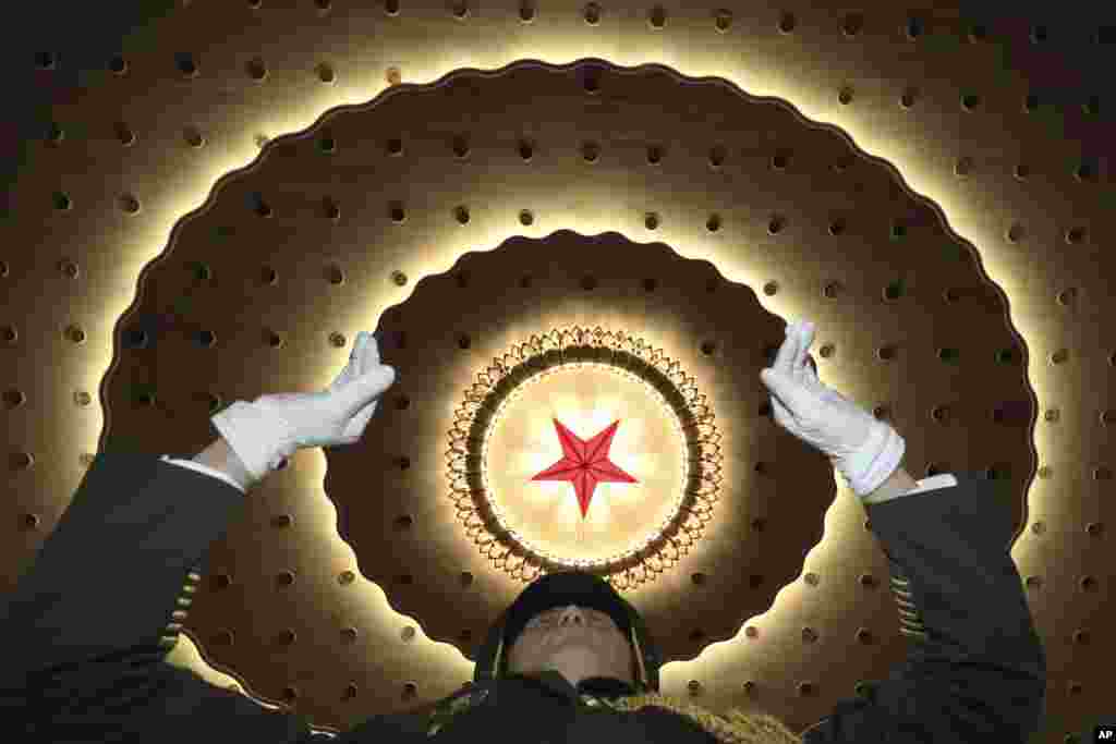 A Chinese military band conductor leads the band to rehearse before the opening session of the Chinese People&#39;s Political Consultative Conference (CPPCC), in Beijing&#39;s Great Hall of the People.