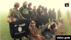 FILE - Image from purported Islamic State group video shows captives.