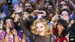 Director Madonna arrives on the red carpet for the film "W.E." during the 36th Toronto International Film Festival (TIFF) in Toronto September 12, 2011.