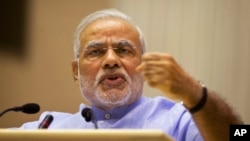 Indian Prime Minister Narendra Modi speaks at the launch of a campaign aimed at opening millions of accounts for poor Indians in New Delhi, Aug. 28, 2014.