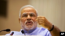 Indian Prime Minister Narendra Modi speaks at the launch of a campaign aimed at opening millions of accounts for poor Indians in New Delhi, Aug. 28, 2014.