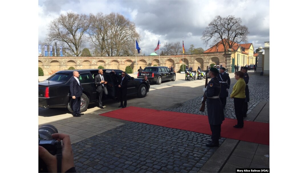 German Chancellor Angela Merkel, right, greets U.S. President Barack Obama at the stately Schloss Herrenhausen, once the summer residence of the Royal House of Hannover, April 24, 2016.