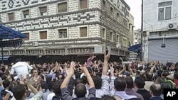 Mourners attend the funerals of protesters killed in earlier clashes in the Syrian city of Homs Apr18 2011