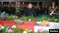 North Korean leader Kim Jong Un attends a wake for the late Korean People's Army General Ri Ul Sol, on Nov. 8, 2015. 