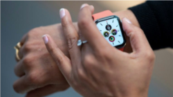 Researchers are seeking to use data collected from wearables like the Apple Watch for early signals of coronavirus infections (AFP Photo/Johannes EISELE)