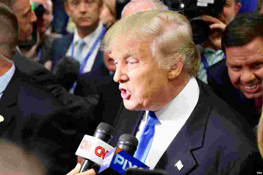 Republican candidate Donald Trump talks to the media after the debate. (B. Allen/VOA)
